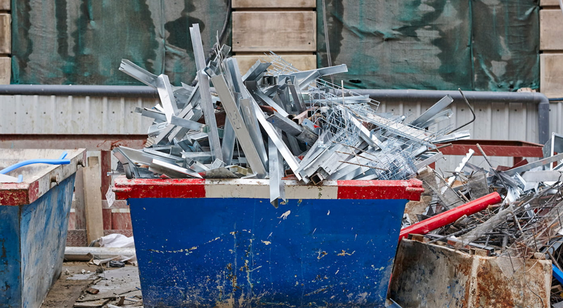 Scrap metal in a skip at a construction site.