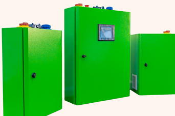 Three green industrial cabinets with various controls on top and a window on the front of the largest one.