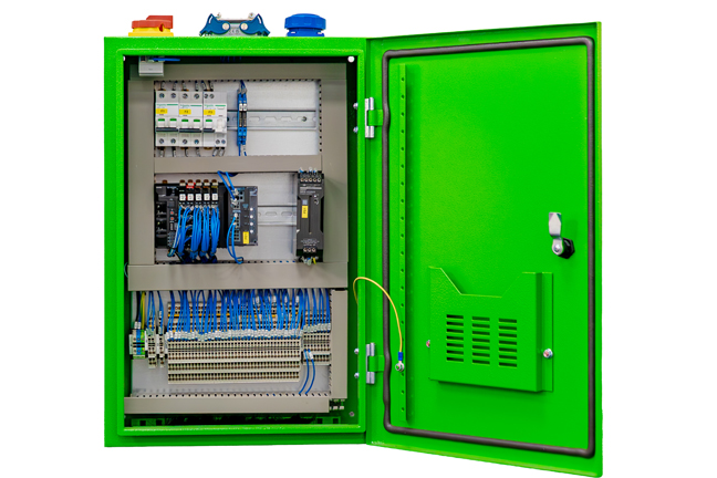 Open green electrical control cabinet displaying various components and wiring inside.